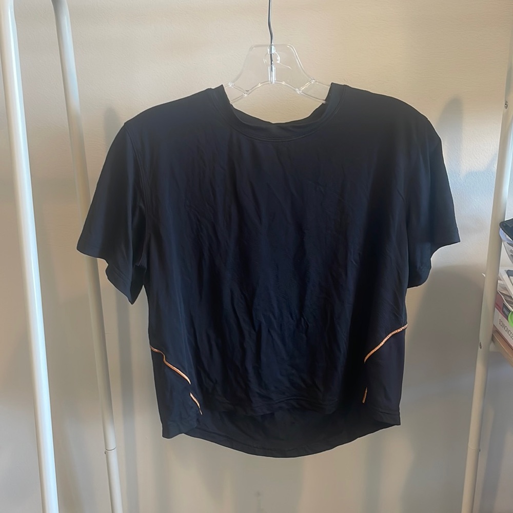 Black Lululemon workout shirt with orange seams - size 4!